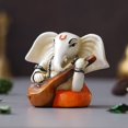 thumbnail image 4 of Polyresin Handcrafted Lord Ganesha Idol Playing Veena Musical Instrument, White & Orange, 4 of 5
