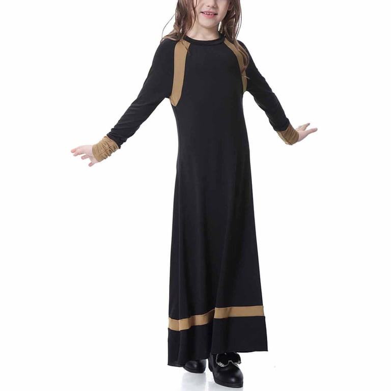 2017 fall dress muslim Tehran, Iran - April 29, 2017: A Muslim woman in a black Islamic chador stands near a full-length female mannequin dressed in a short summer dress, s Stock Photo
