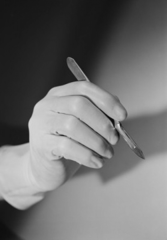Hand holding scalpel Poster Print (24 x 36)