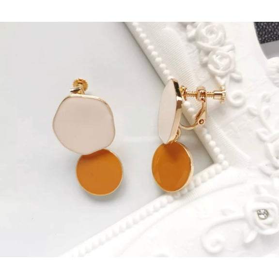 Clip on 1 1/4" gold, cream and gold odd shaped double circle dangle earrings