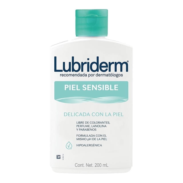 crema corporal lubriderm piel sensible 200 ml botella blanca frontal con tapa verde; envase rectangular con etiqueta 'Piel Sensible', hipoalergénica y sin colorantes ni perfume, formulada para hidratación profunda y textura ligera que se absorbe rápido; vista centrada sobre fondo blanco, a menudo se usa para suavizar piel seca en la rutina diaria.