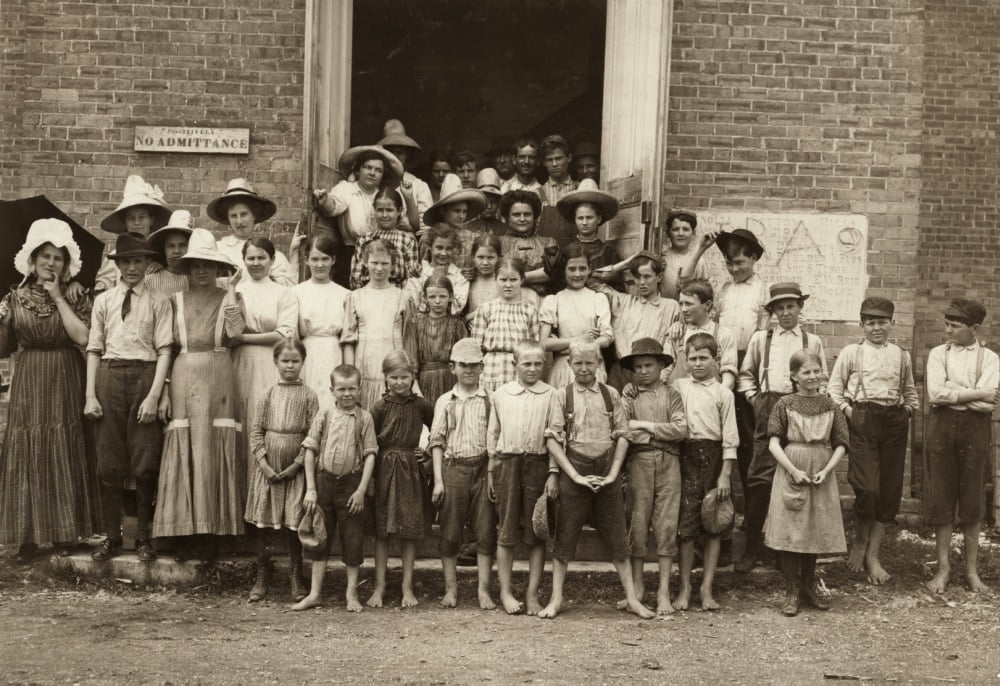 Hine Child Labor, 1911. /Na Cotton Mill Supervisor With A Group Of Young Spinners At A Textile