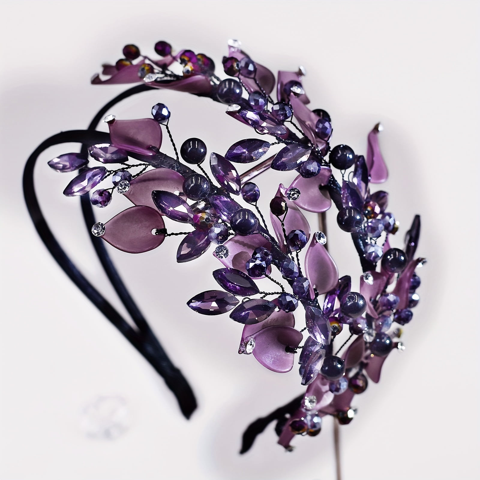 A stylish double-layered headband, designed for women, features purple polymer clay leaf patterns and rhinestones, making it the perfect accessory for photoshohoots and everyday wear.