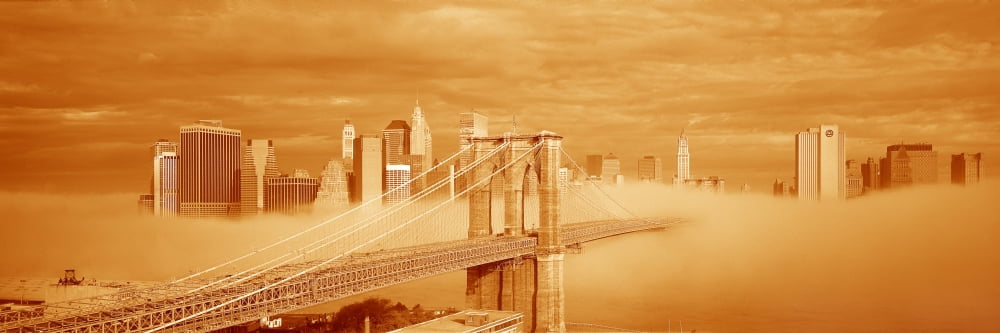 This is a sepiatone of the Brooklyn Bridge over the East River with the Manhattan skyline behind it There is a morning fog enveloping the bridge and make it look like the Emerald City in the Land of O