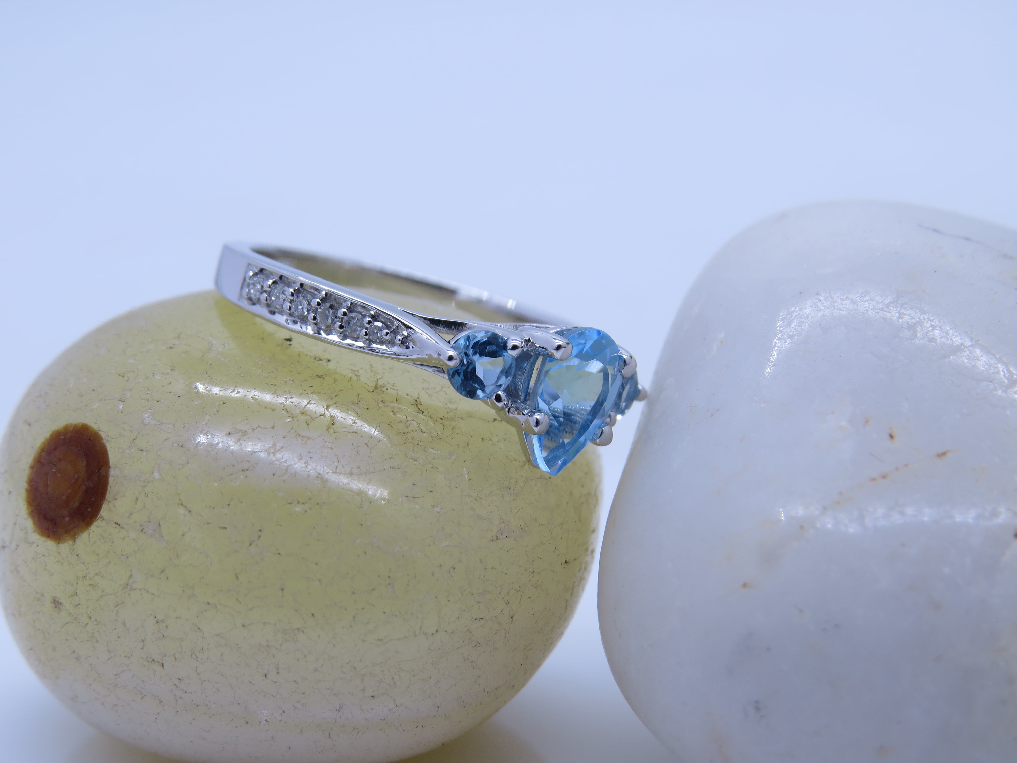 Dazzlingrock Collection 7X5MM Pear Blue Topaz & Round White Diamond 3 Stone Teardrop Engagement Ring for Women (0.10 ctw, Color I-J, Clarity I1-I2) in 18K White Gold, Size 7.5