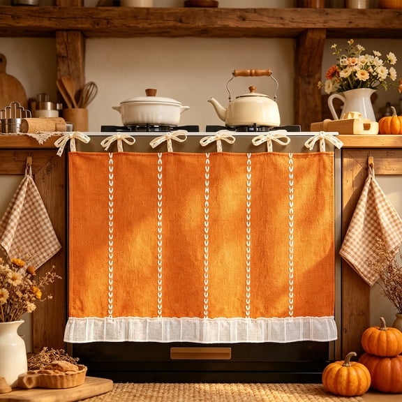 Halloween oven skirt, orange mesh oven curtain with lace bows, stove curtain with ruffle trim for fall kitchen decor and vintage farmhouse styling.
