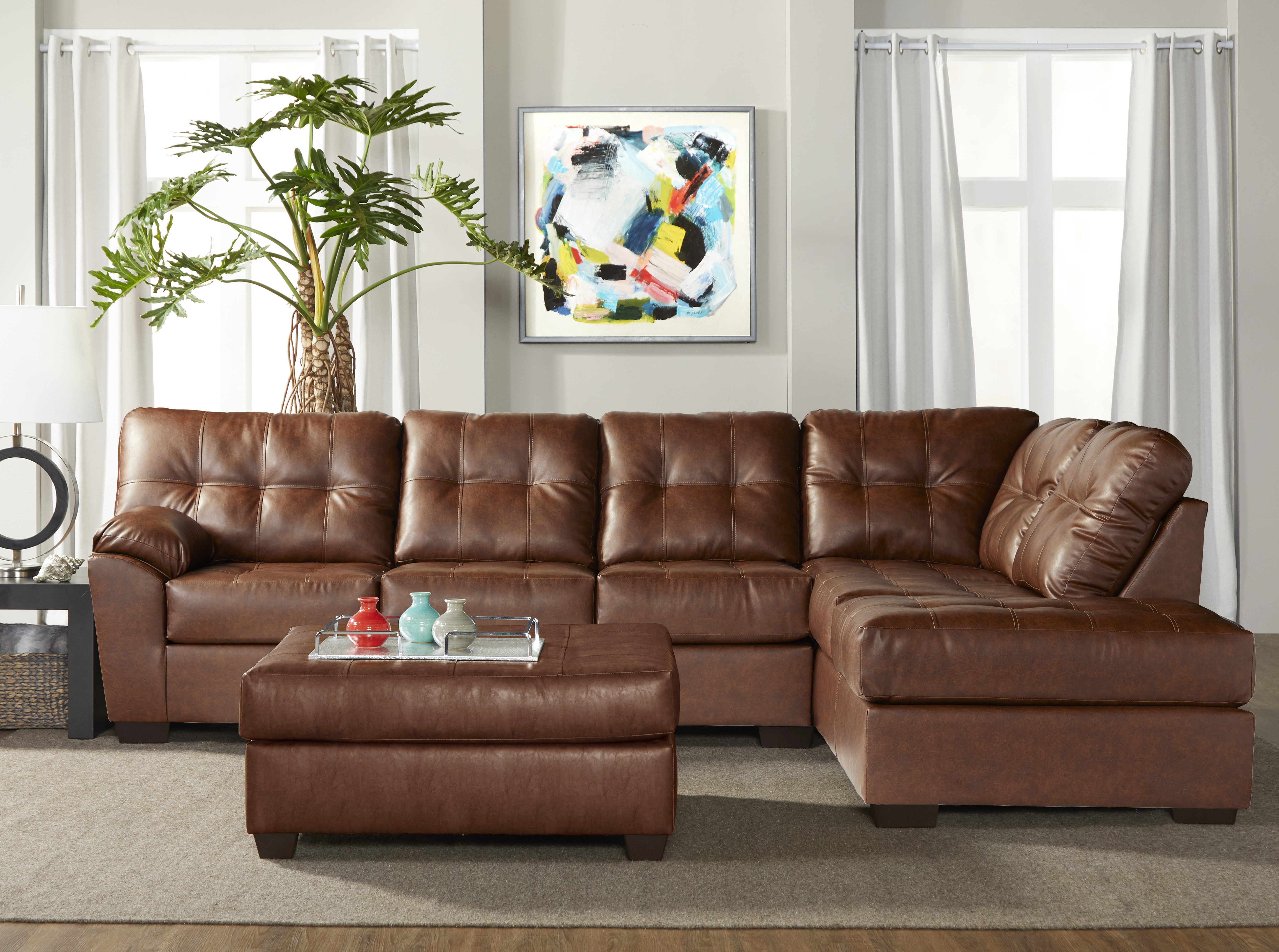 Chania Faux Leather Tufted Sectional Sofa with Ottoman in San Marino