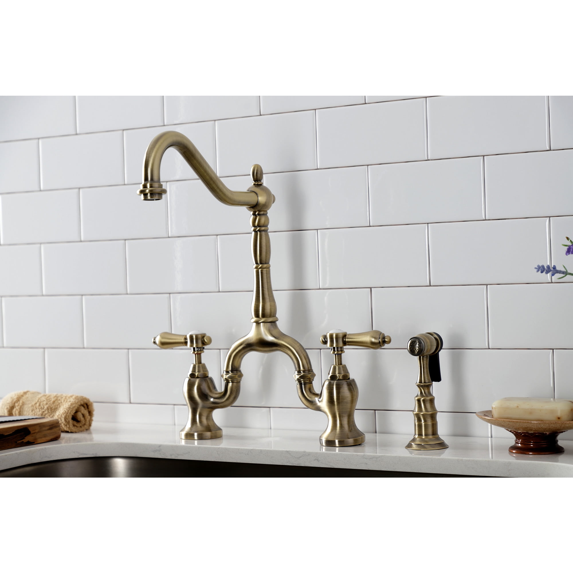 Kingston Brass KS7753BALBS Heirloom Two-Handle 3-Hole Deck Mount Bridge Kitchen Faucet with Brass Side Sprayer in Antique Brass