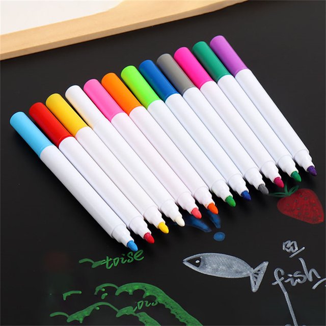 12 Color Water Soluble Liquid Chalk, Erasable Light Board Pens, and Erasable White Chalk for Blackboards. This pack of 12 broad line washable markers includes vibrant colors such as red, blue, green, yellow, pink, purple, orange, cyan, magenta, brown, black, and white. The markers feature a water-soluble, non-toxic, quick-drying formula, making them safe for children and adults. They are suitable for use on blackboards, light boards, glass, and other smooth surfaces, and can be easily erased with a damp cloth. The broad line tip allows for versatile applications, from bold strokes to finer details. The markers are displayed on a black surface with colorful drawings, showcasing their bright pigmentation.