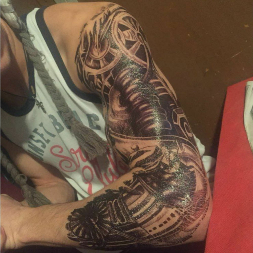 Terminator arm tattoo by Phil Robertson TattooNOW