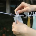 thumbnail image 3 of Retractable Windproof Clothesline with 12 Clips, 70.87in Heavy-Duty Elastic Rope for Indoor/Outdoor Drying, Portable Travel Laundry Line, 3 of 6