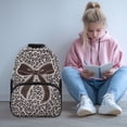 thumbnail image 2 of HUISEFOR Leopard Print Bow School Backpack for Teen Girls 17 Inches Large Capacity School Bag with Front Zipper, Lightweight Comfortable Shoulder Bookbag for Primary Back to School, 2 of 7