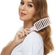 thumbnail image 5 of Un peine ancho, curvo y ventilado, un cepillo que separa el cabello y elimina los enredos., 5 of 6