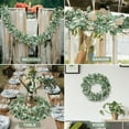 thumbnail image 4 of Scidweet 2 Pack Christmas Greenery Garlands, 13 ft Artificial Greenery Eucalyptus leaf Garland with White Buds for Home Wedding Party Table  Mantle Holiday Christmas Decorations, 4 of 7