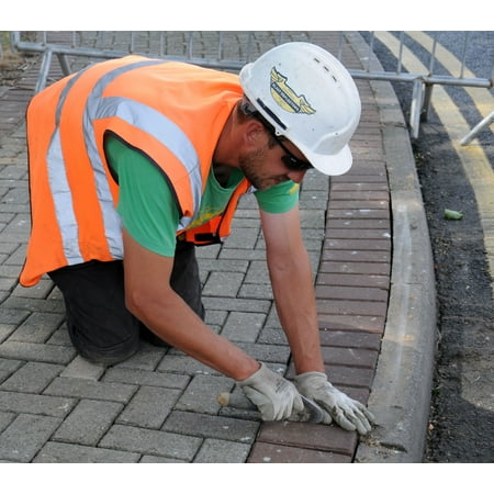 LAMINATED POSTER Matthew Bateson, a contractor from Kings Lynn, Norfolk, uses a trowel to place a gap between bricks Poster Print 24 x (Best Places To Go In Norfolk)