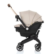 Evenflo Shyft DualRide Infant Car Seat and Stroller Combo with Green & Gentle Fabric, Champagne