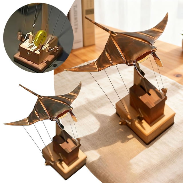 RKSTN Bat pendulum upgraded handmade wooden ray ornament automaton with lifelike swimming motion. The design features a carved solid wood base with a matte finish, showcasing natural wood grain. The mechanical ray is suspended by wires, mimicking realistic wing flapping and gliding movements. Perfect for home decor, desks, coffee tables, or bookshelves as a tabletop accent.
