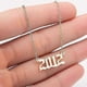 thumbnail image 1 of Charm Pendant Necklace in Stainless Steel Celebrating Birth Years 1980-2019, 1 of 5