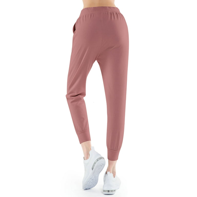 Women's pink joggers with band and stars on the sides