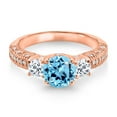 thumbnail image 2 of Gem Stone King 18K Rose Gold Plated Silver Swiss Blue Topaz White Topaz and White Moissanite Engagement Ring for Women (2.39 Cttw, Gemstone November Birthstone, Round 7MM and 4MM, Size 7), 2 of 3