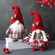 thumbnail image 5 of Estatua de Papá Noel sin rostro que decora la ventana con adornos navideños, 5 of 7