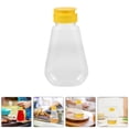 thumbnail image 3 of Frascos de miel de plástico, recipientes vacíos transparentes para miel, dispensador de miel, botella exprimidora con tapas, soporte para miel, 2 uds., 3 of 5