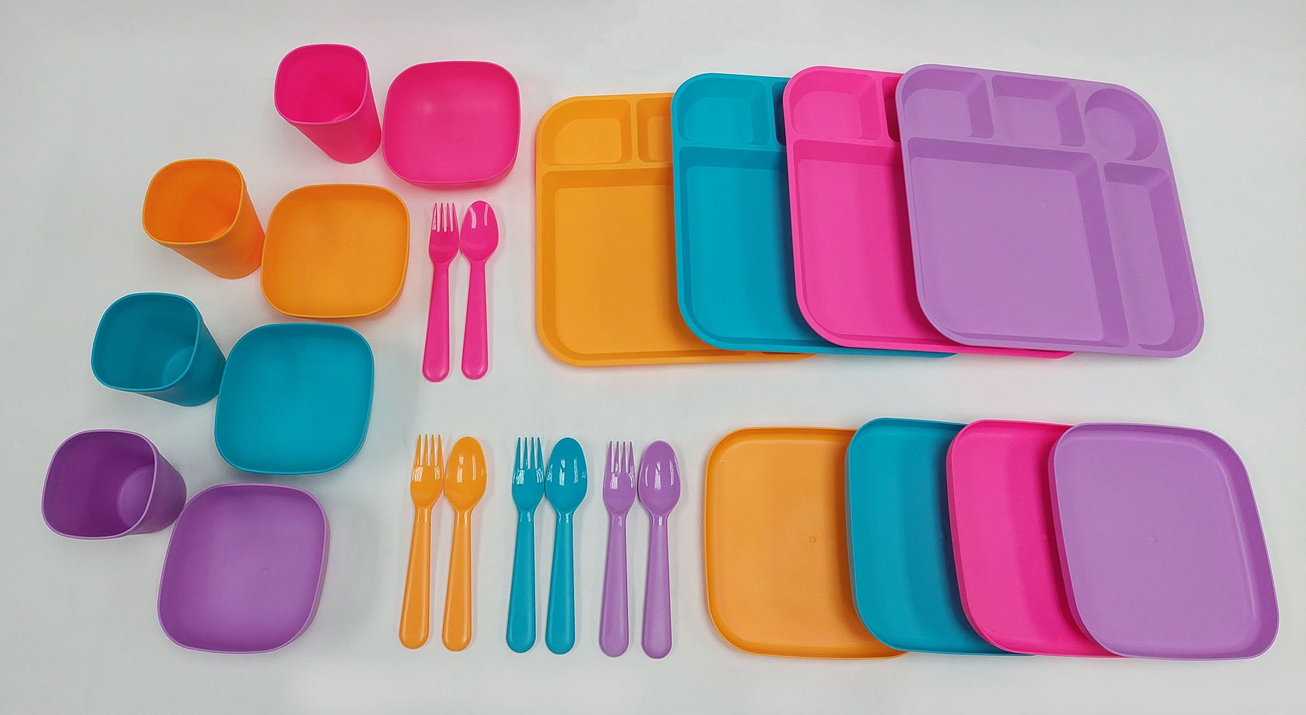 Your Zone 24 Piece Plastic Dinnerware Set for Kids with 4 each Trays, Bowls, Plates, Cups, Forks, Spoons in Bright Pink, Teal, Purple, Orange