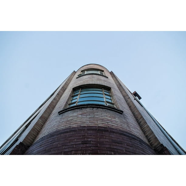 Colorful Building and Bright Blue Sky Poster