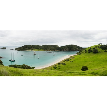 Boats docked in small bay at Waewaetorea Island Bay of Islands Northland Region North Island New Zealand Stretched Canvas - Panoramic Images (13 x