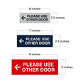 thumbnail image 2 of All Quality PLEASE USE OTHER DOOR Sign - (Left Arrow) (Red) - Medium 3" x 8", 2 of 5