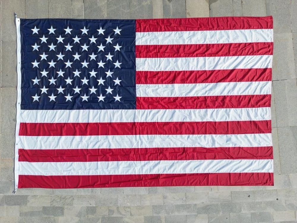 NYL-TUFF 10x15 Foot Nylon 300 Denier Heavy Duty American Flag Has Appliqued Stars, Sewn Stripes, Brass Grommets, Roped Thimbles, Canvas Header and Corner Patches