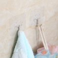 thumbnail image 2 of Ganchos de pared transparentes, reutilizables, sin costuras, impermeables y a prueba de aceite, ganchos autoadhesivos resistentes para baño y cocina, paquete de 10 ER, 2 of 4