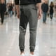 thumbnail image 5 of Pantalones largos para hombre, informales, de color sólido, con cintura elástica y bolsillo con cordón, deportivos, hasta el tobillo, de poliéster., 5 of 8