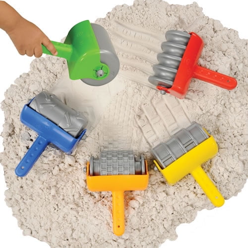 5 textured sand rollers in a pile of sand