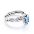 thumbnail image 3 of JeenMata Pave Halo Setting 1.75 Carat Oval Cut Light Blue Created Aquamarine And Moissanite Infinity Twisted Shank Bridal Set in 18K White Gold Plating over Silver, 3 of 6