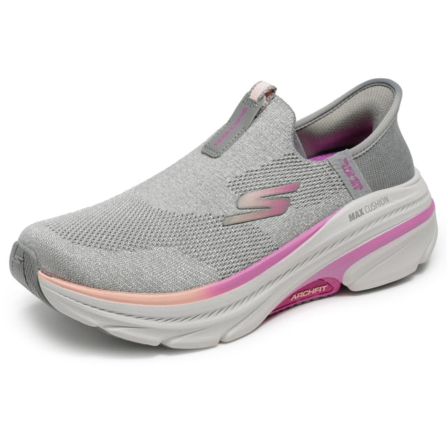 zapatilla skechers max cushioning arch fit 2.0 cambridge para mujer slip-on sin cordones color negro con tejido knit gris claro y detalles rosa, vista 3/4 frontal que muestra logo S lateral, entresuela gruesa blanca con banda rosa y marca ARCHFIT en la suela.