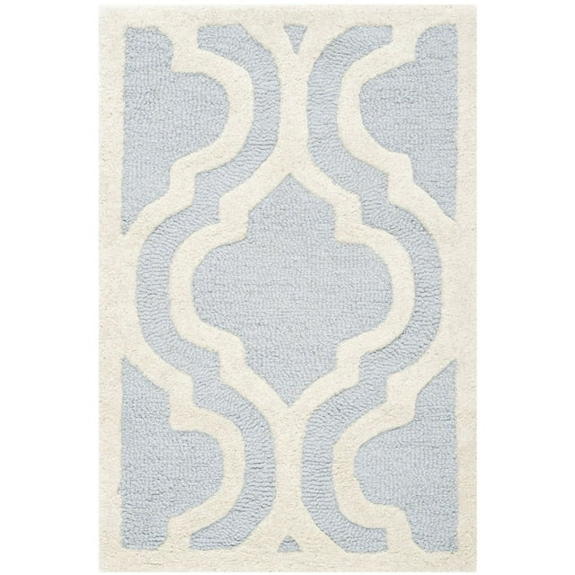 Safavieh Cambridge Kirsten area rug featuring a light blue and cream geometric pattern with a plush, textured surface.