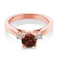 thumbnail image 2 of Gem Stone King 18K Rose Gold Plated Silver Red Garnet and White Topaz 3-Stone Engagement Ring for Women (1.28 Cttw, Round 6MM, Gemstone January Birthstone, Size 5), 2 of 3