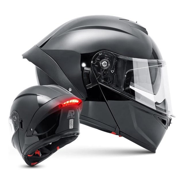 casco moto abatible luz led anti niebla espejo doble lustroso NOBRAND, vista lateral y trasera de casco modular certificado DOT en gris oscuro, visera transparente bajada, spoiler trasero con tira LED roja encendida, bisagra de apertura frontal, forro EPS y acolchado interior visibles; incluye cable USB y bolsa. Su tamaño compacto es adecuado para viajes y uso diario.