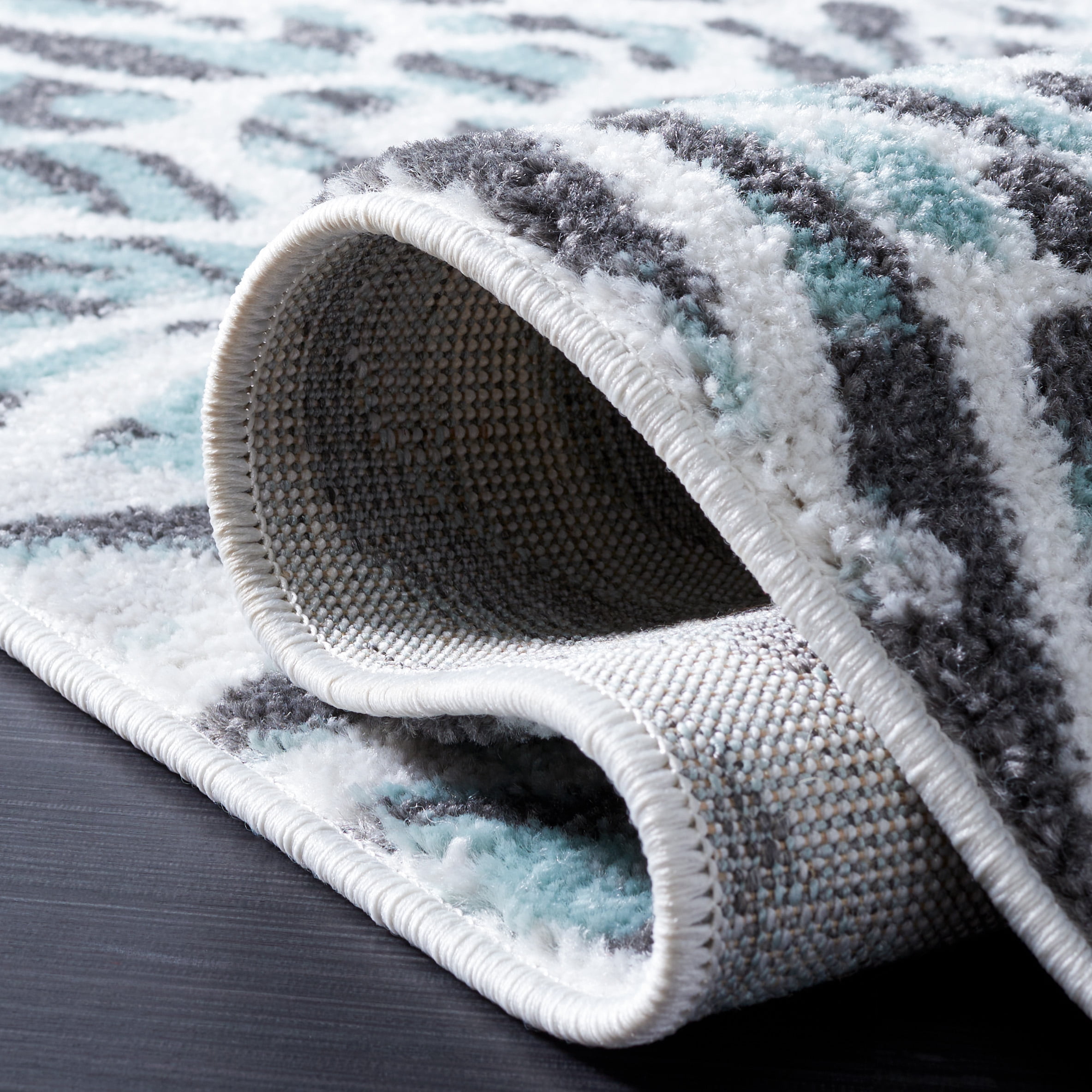 SAFAVIEH Amsterdam Ruby Animal Area Rug, Ivory/Teal, 6'7" x 9'2"