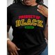 thumbnail image 1 of Women's "Black History" Graphic Tee - Casual, Round Neck, Short Sleeve, Machine Washable, Black with Bold Lettering & Green Accents, 1 of 5