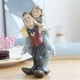 thumbnail image 2 of Estatua de pareja moderna, adorno de personaje, figura artesanal de resina, escultura para mesa Novio llevando novia, 2 of 8
