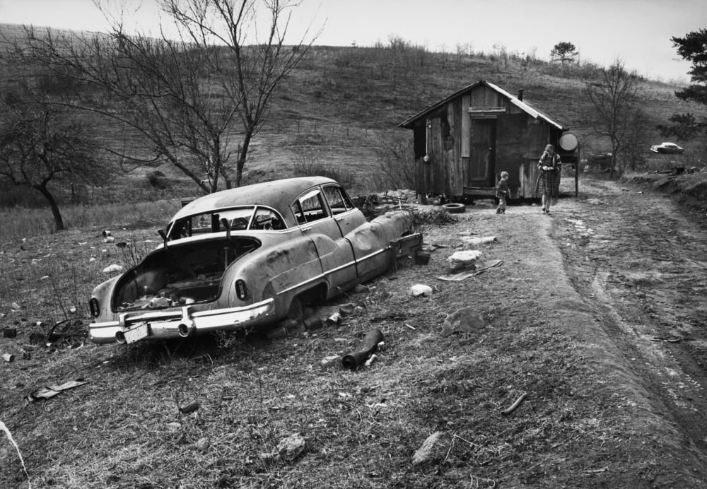 Poverty Appalachia, C1971. /Na Woman And Boy Outside A Shack In Rural Appalachia. Photograph