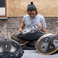 thumbnail image 4 of Gonipol Handpan Drum 22 Inches D Minor, 12 Notes Hand Drum Instrument, 440HZ Premium Steel Hand Drum, Storage Bag, Mallet, Braid, Stand, Sound Stickers, Cleaning Cloth for Beginners (Black), 4 of 10