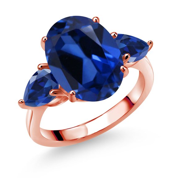 Gem Stone King 18K Rose Gold Plated Silver Blue Simulated Sapphire and Blue Created Sapphire Ring for Women (8.00 Cttw, 14X10MM Oval and 7X5MM Pear Shape, Gemstone, Size 7)