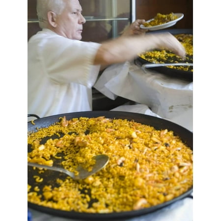 Man Serving Paella, with Noodle Paella in Foreground, Central, Valencia, Spain Print Wall Art By Greg