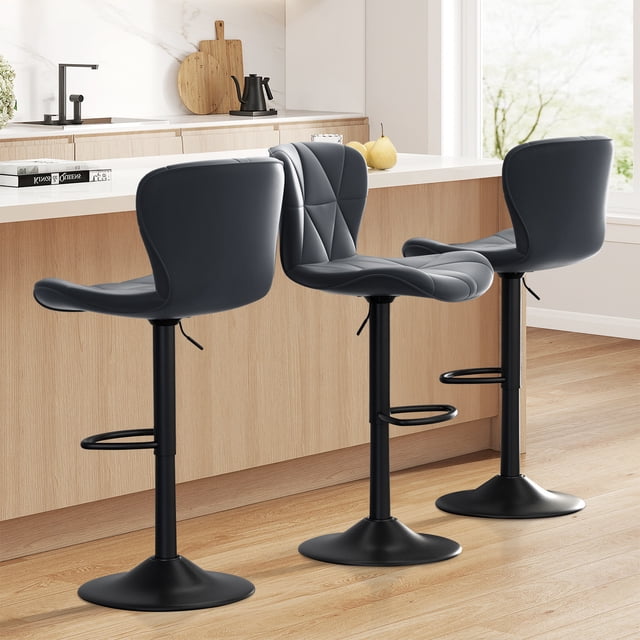 Hawsaiy Modern Bar Stools Set of 3 in dark gray, featuring adjustable faux leather upholstered swivel seats with ergonomic backrests. These stools have a height range of 24.8”-33.46” and a 360° swivel function, supported by a sturdy black pedestal base with footrests. Designed for kitchen islands or home bars, they are shown in a modern kitchen setting with a light wood floor and a white countertop.