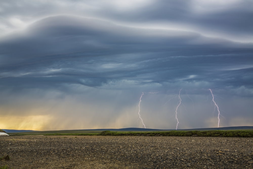 Lightning bolts descend from dark clouds over the tundra of Alaskas northwest arctic and the Kokolik River Kokolik National Petroleum Reserve Arctic Alaska USA Canvas Art - David Shaw Design Pics (38