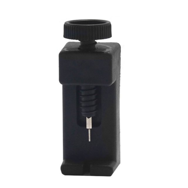reloj link band hendidura correa pulsera cadena pin remover ajustador herramienta reparación Herramienta removedor de pasadores para correas de reloj, vista frontal centrada de prensa compacta en negro con tornillo giratorio superior, cuerpo rectangular con ranura inferior para sujetar eslabón y aguja metálica para empujar pasadores; medida 80×30×22 mm, suele usarse para ajustar pulseras en casa o por aficionados al relojero.