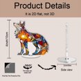 thumbnail image 2 of Rotating acrylic ornament features colorful glass fragments forming a decorative wolf glowing brilliantly in sunlight against a pure white background, 2 of 8